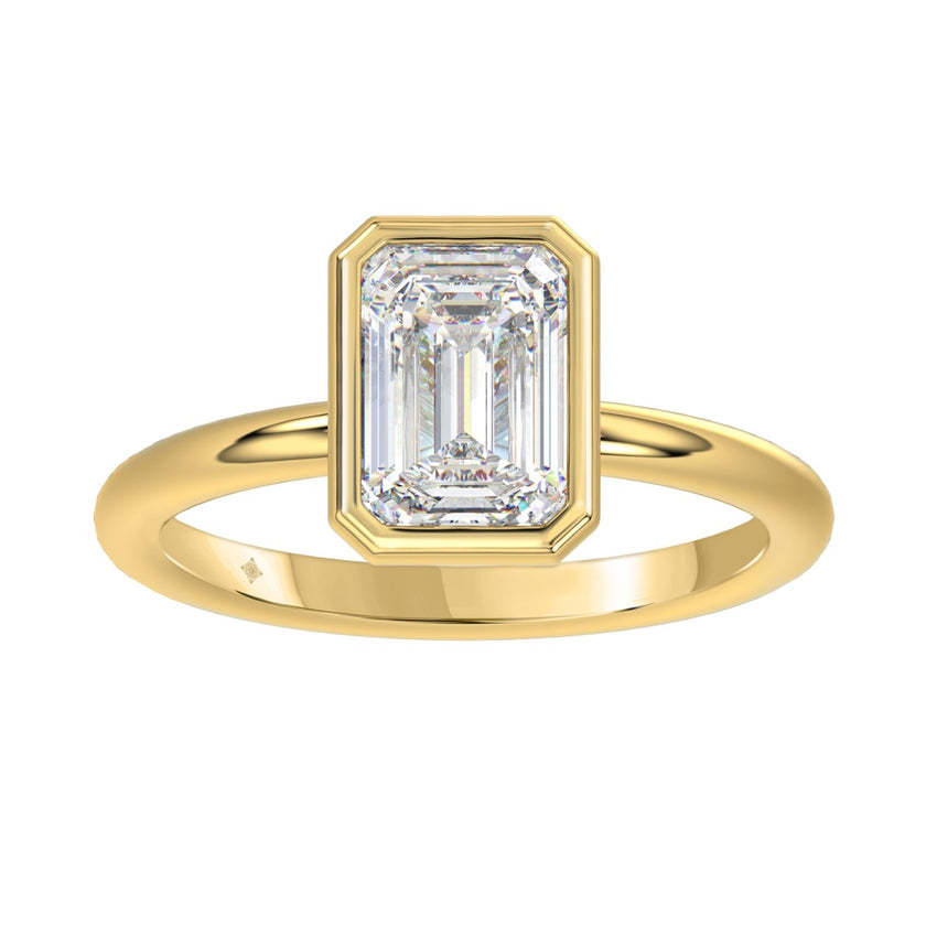 yellow gold bezel emerald cut engagement ring