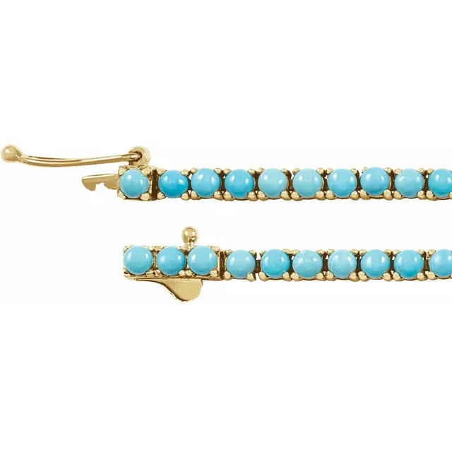   14K yellow gold line design adorned with natural turquoise stones measuring 2.5 mm each. 