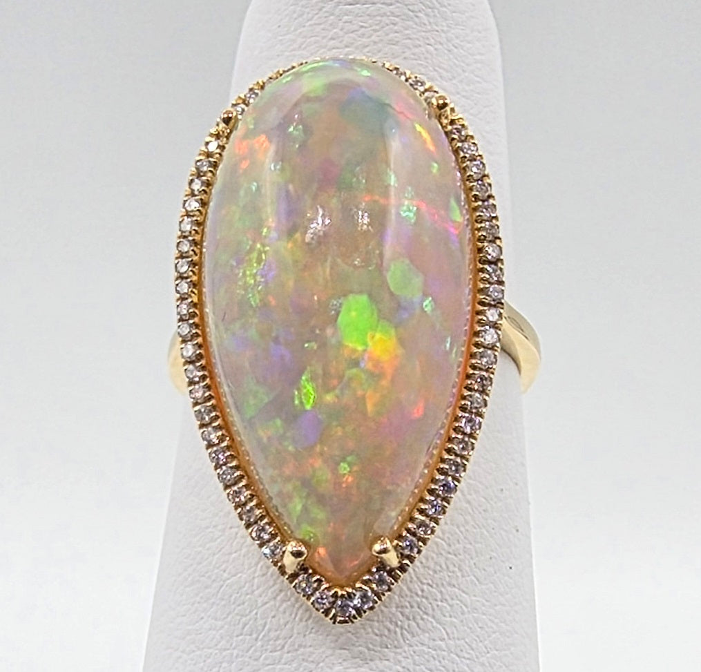 Scintillating Pear Shape Opal and Pave Diamond Halo Ring in 14K Yellow Gold