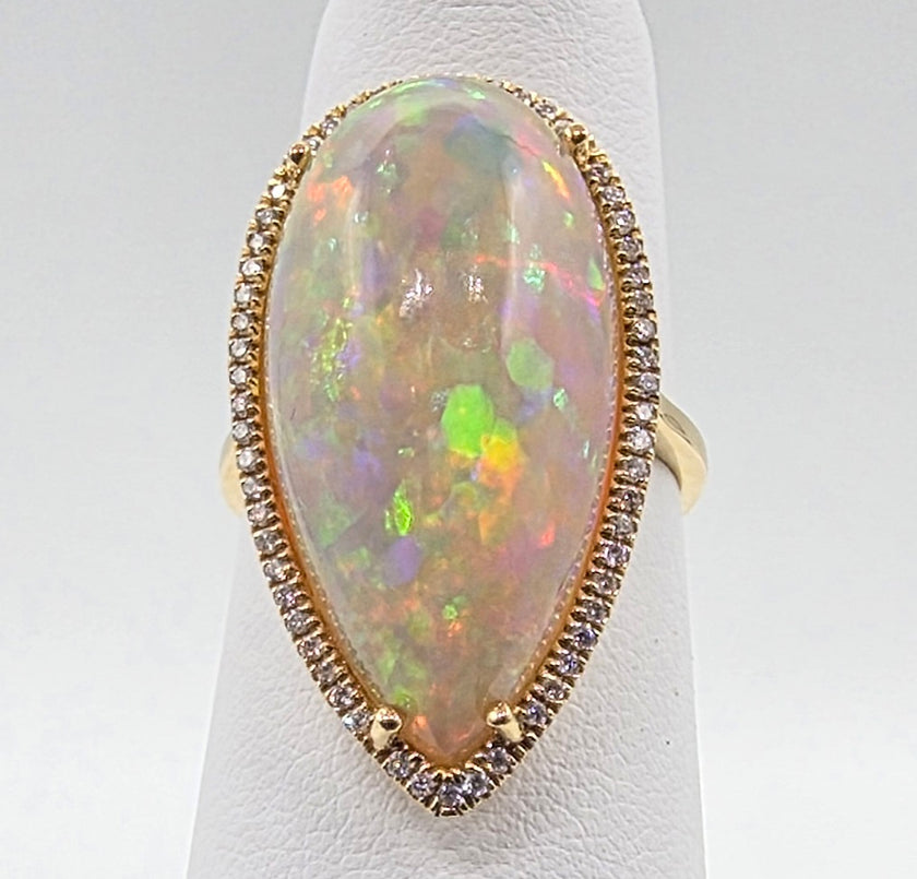 Scintillating Pear Shape Opal and Pave Diamond Halo Ring in 14K Yellow Gold