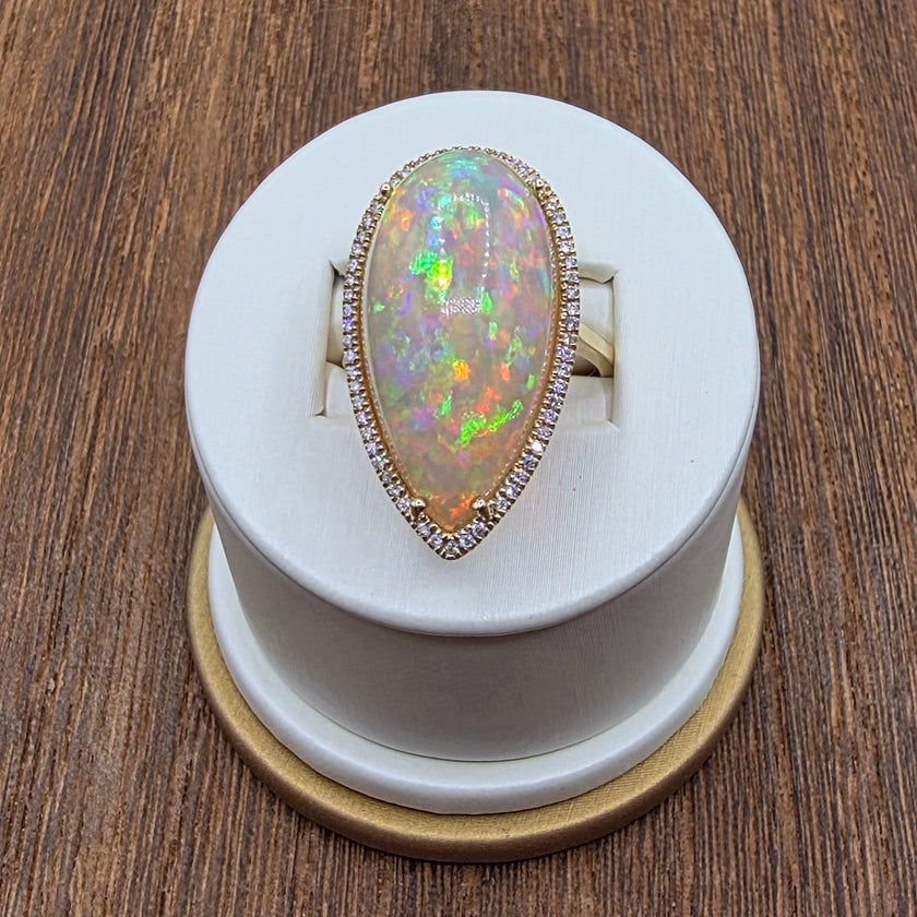 Scintillating Pear Shape Opal and Pave Diamond Halo Ring in 14K Yellow Gold