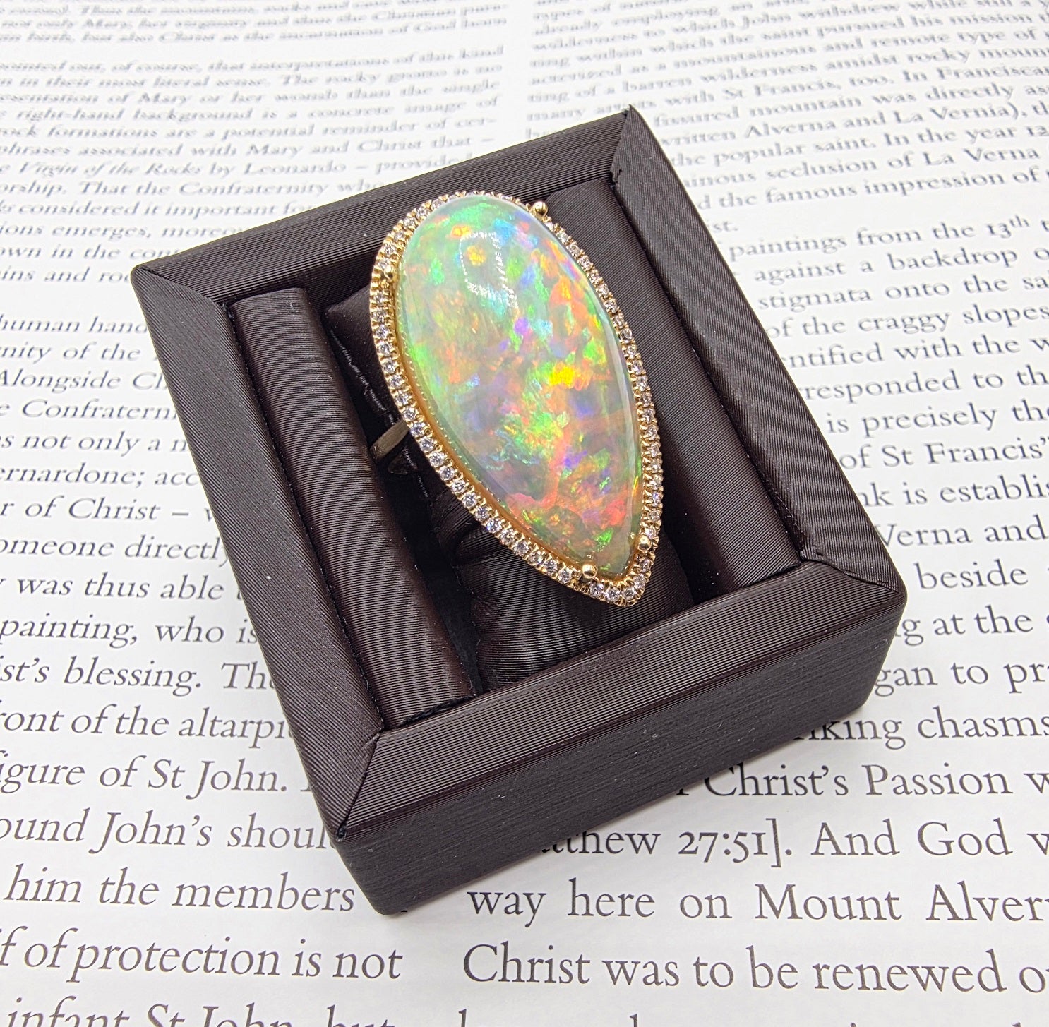 Scintillating Pear Shape Opal and Pave Diamond Halo Ring in 14K Yellow Gold