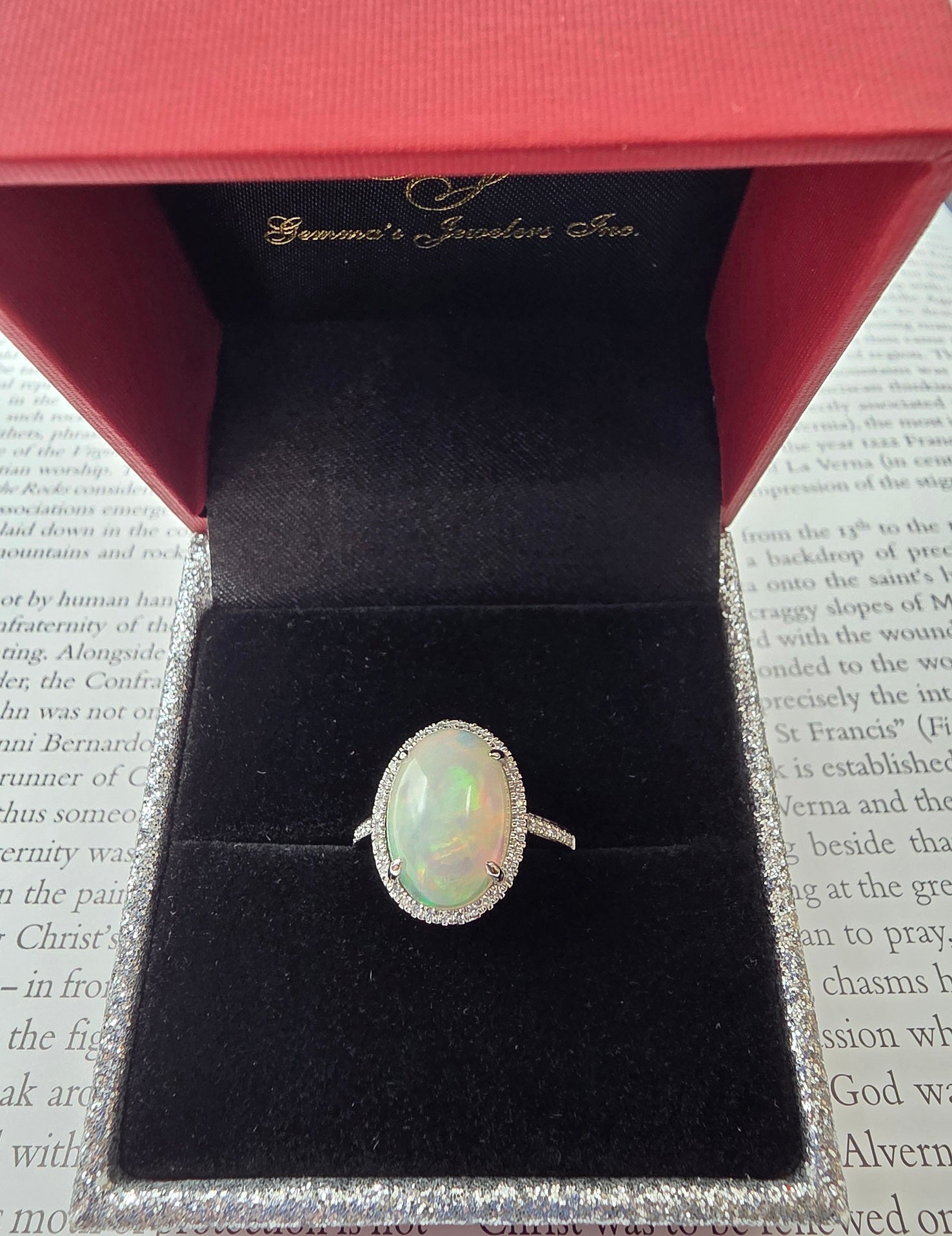 Fiery Oval Shape Opal and Pave Diamond Halo Ring in 14K White Gold