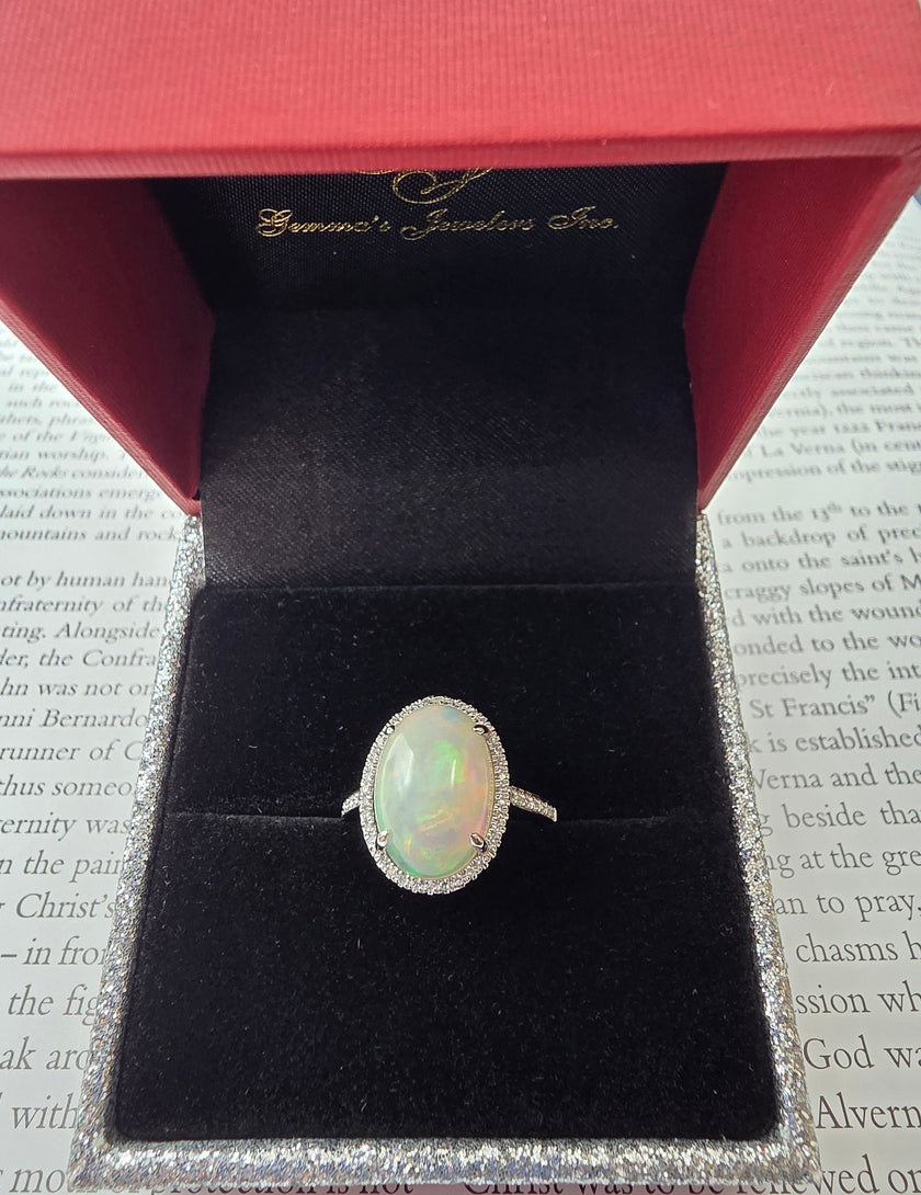 Fiery Oval Shape Opal and Pave Diamond Halo Ring in 14K White Gold