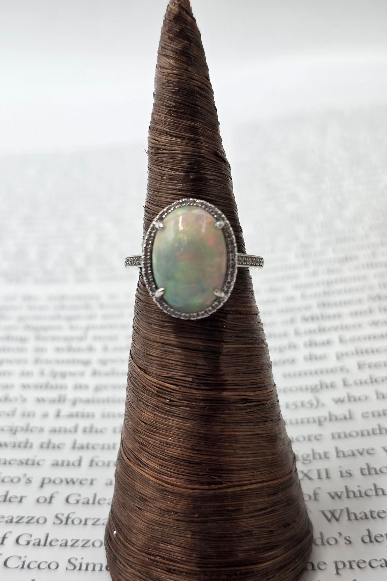 Fiery Oval Shape Opal and Pave Diamond Halo Ring in 14K White Gold