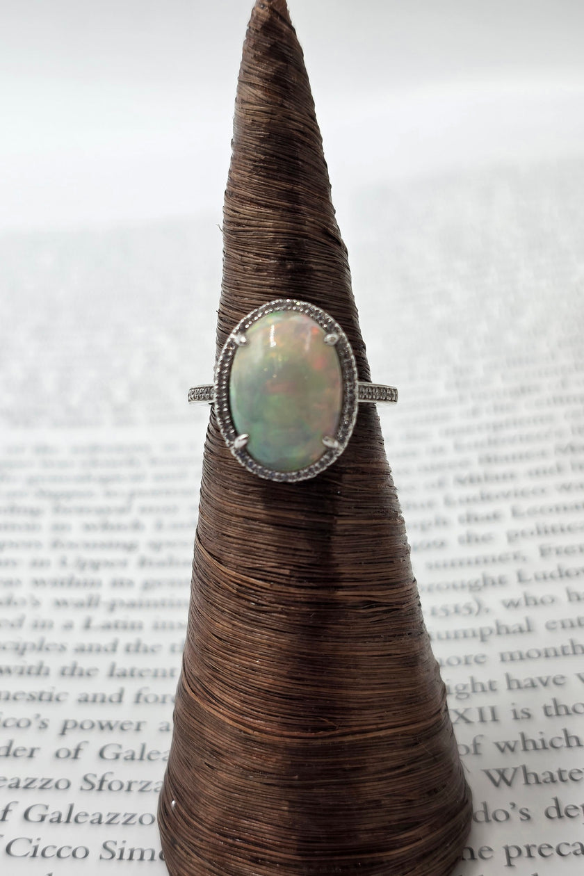 Fiery Oval Shape Opal and Pave Diamond Halo Ring in 14K White Gold
