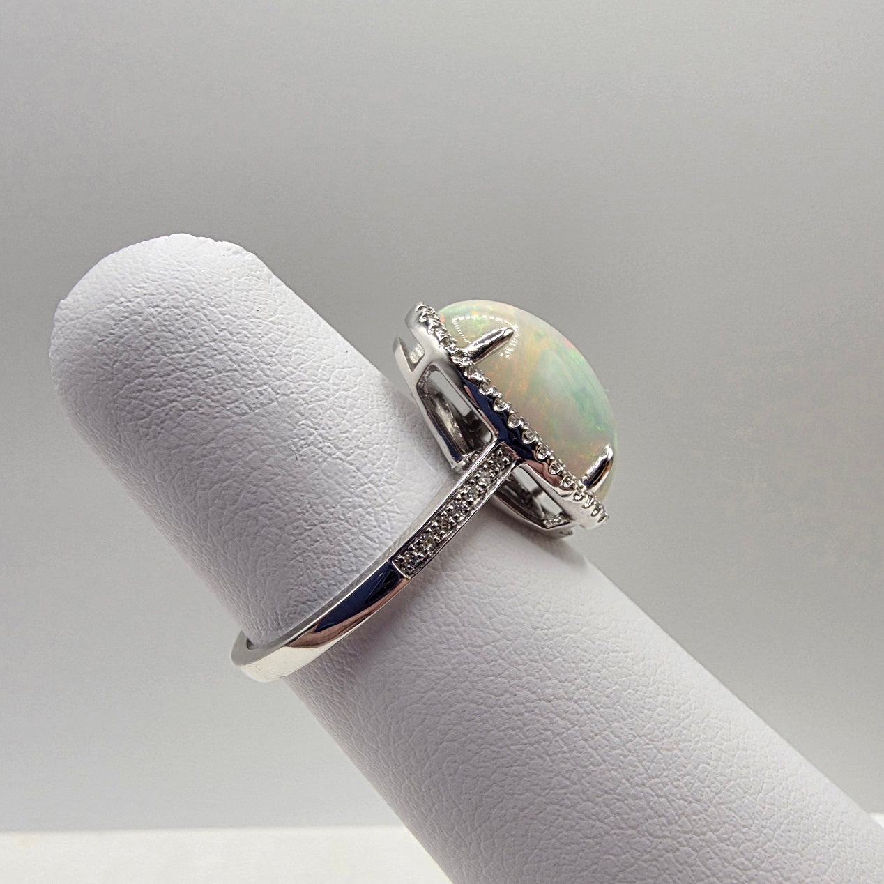 Fiery Oval Shape Opal and Pave Diamond Halo Ring in 14K White Gold