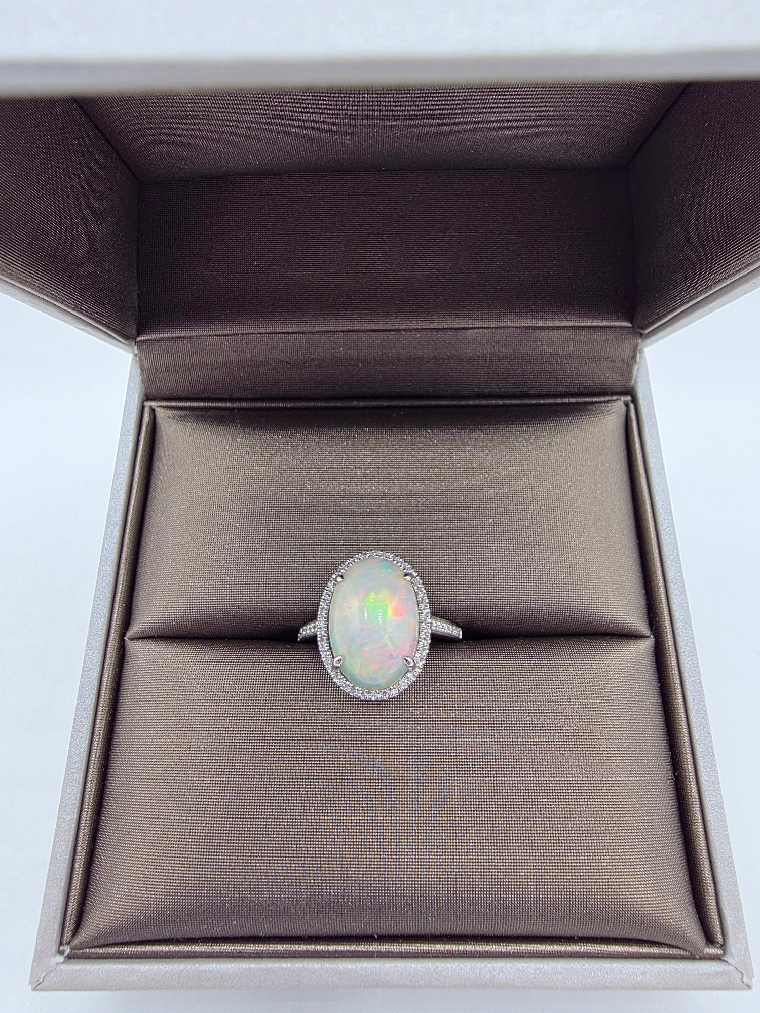 Fiery Oval Shape Opal and Pave Diamond Halo Ring in 14K White Gold