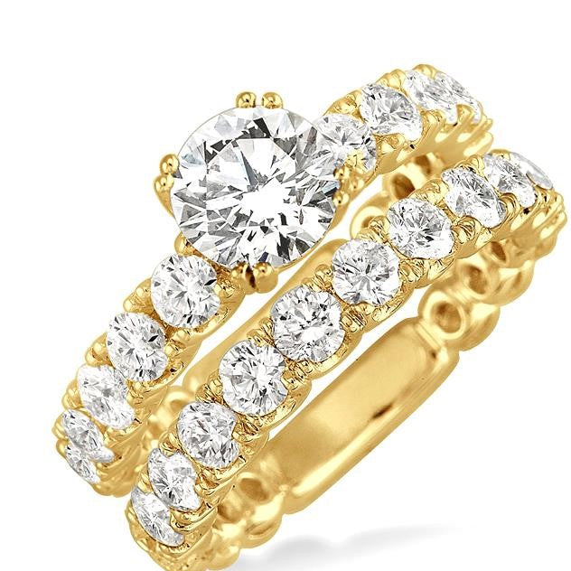 Gold ring with diamonds on a white background, featuring the ASHI brand.