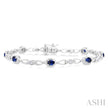 Striking Sapphire and Diamond Precious Fashion Bracelet in 10K White Gold