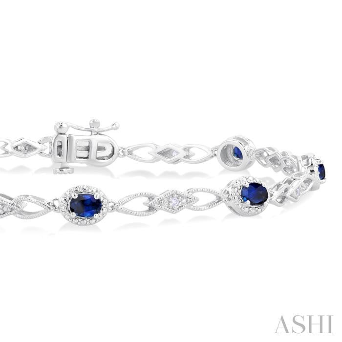Striking Sapphire and Diamond Precious Fashion Bracelet in 10K White Gold