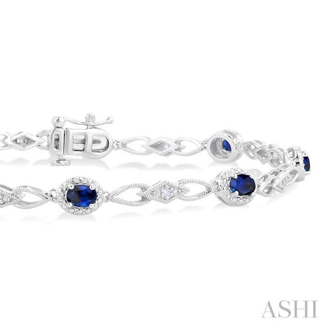Striking Sapphire and Diamond Precious Fashion Bracelet in 10K White Gold
