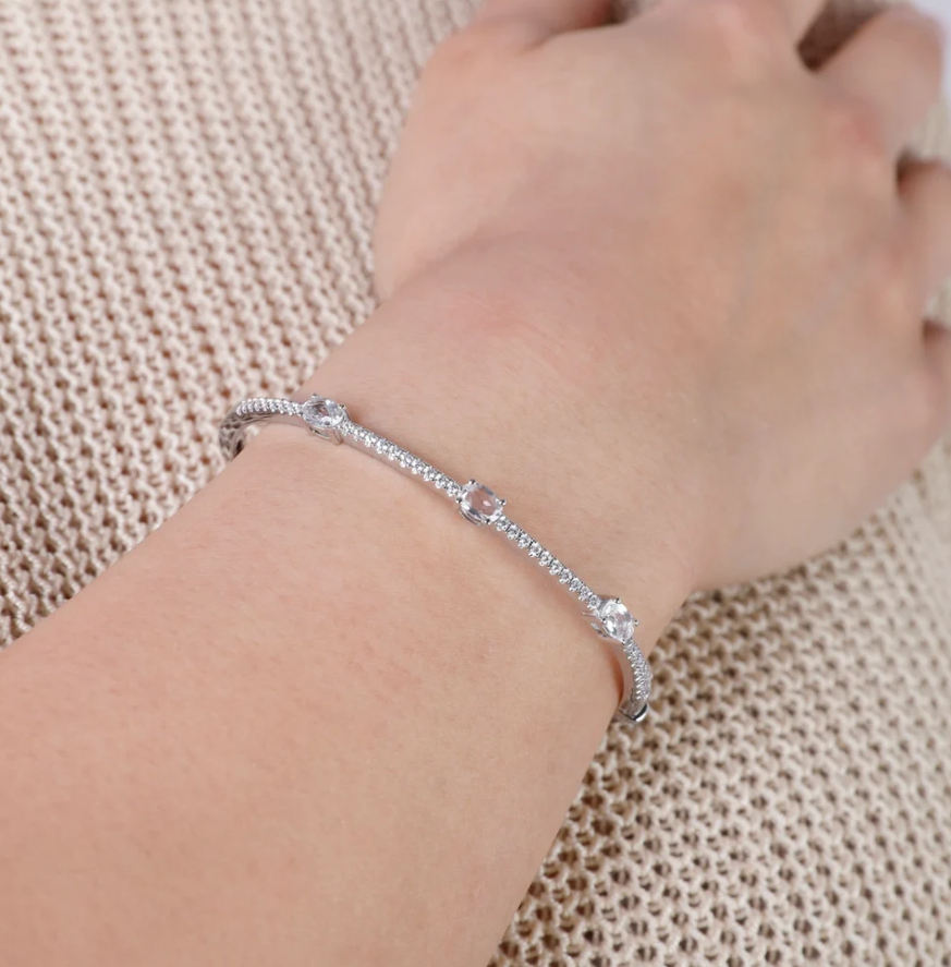 Gorgeous Oval and Pave Diamond Station Bangle in 18K White Gold